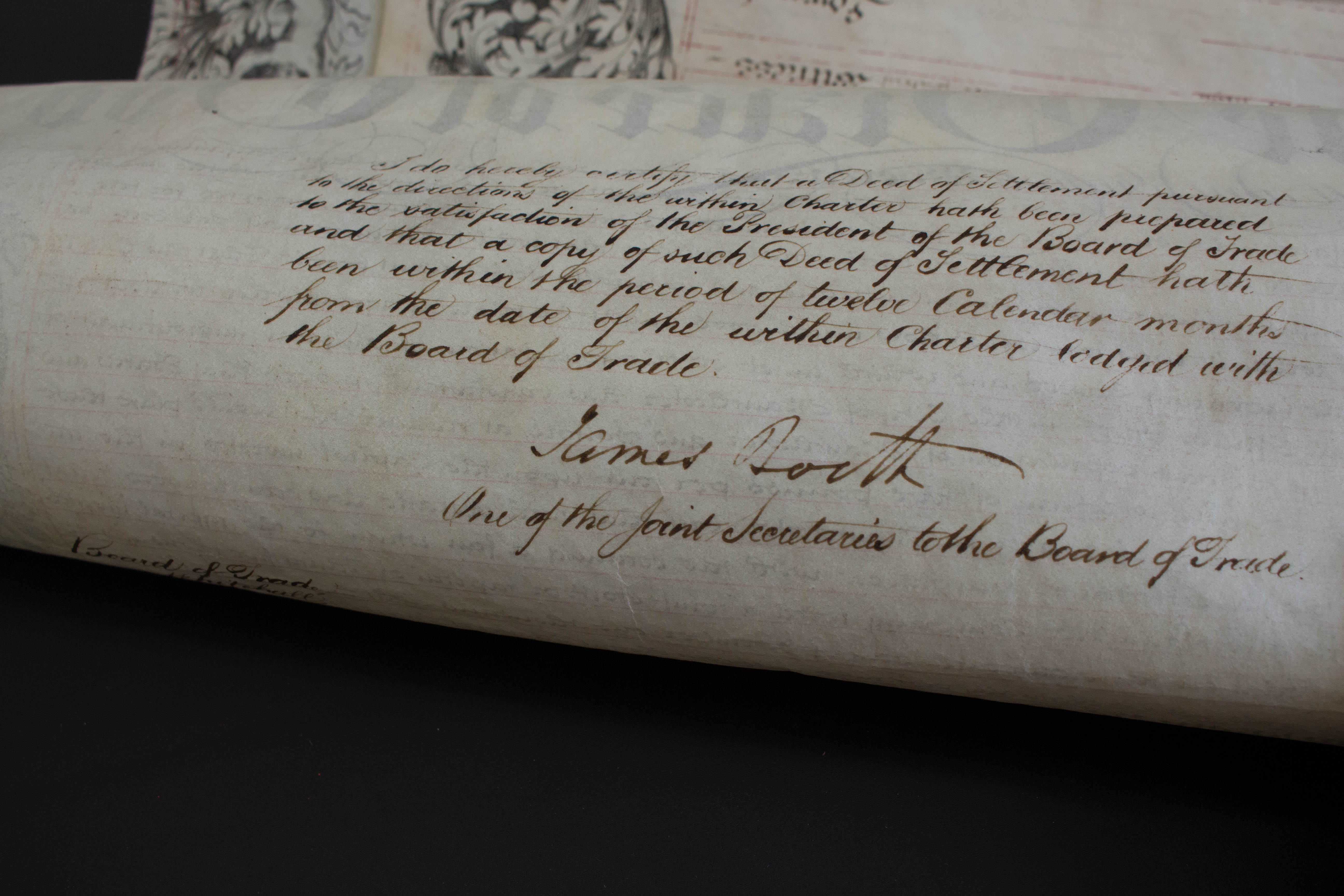 Photo of the back of the Charter with handwriting on it